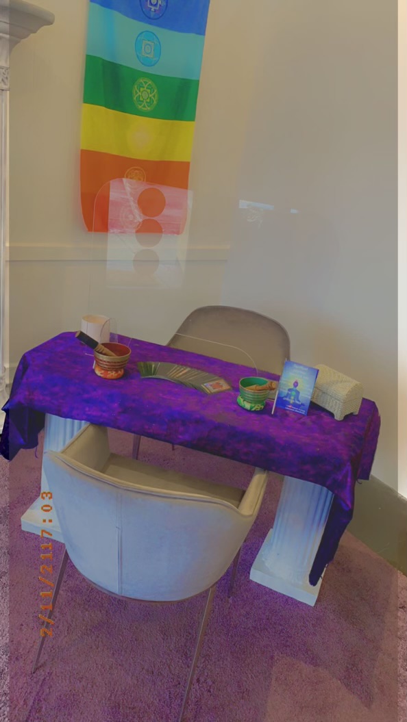 Reading table with chakra banner inside the shoppe